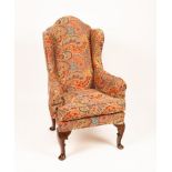 A George II style wingback armchair,