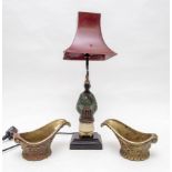Two gilt metal jug mounts and an Asian lamp,