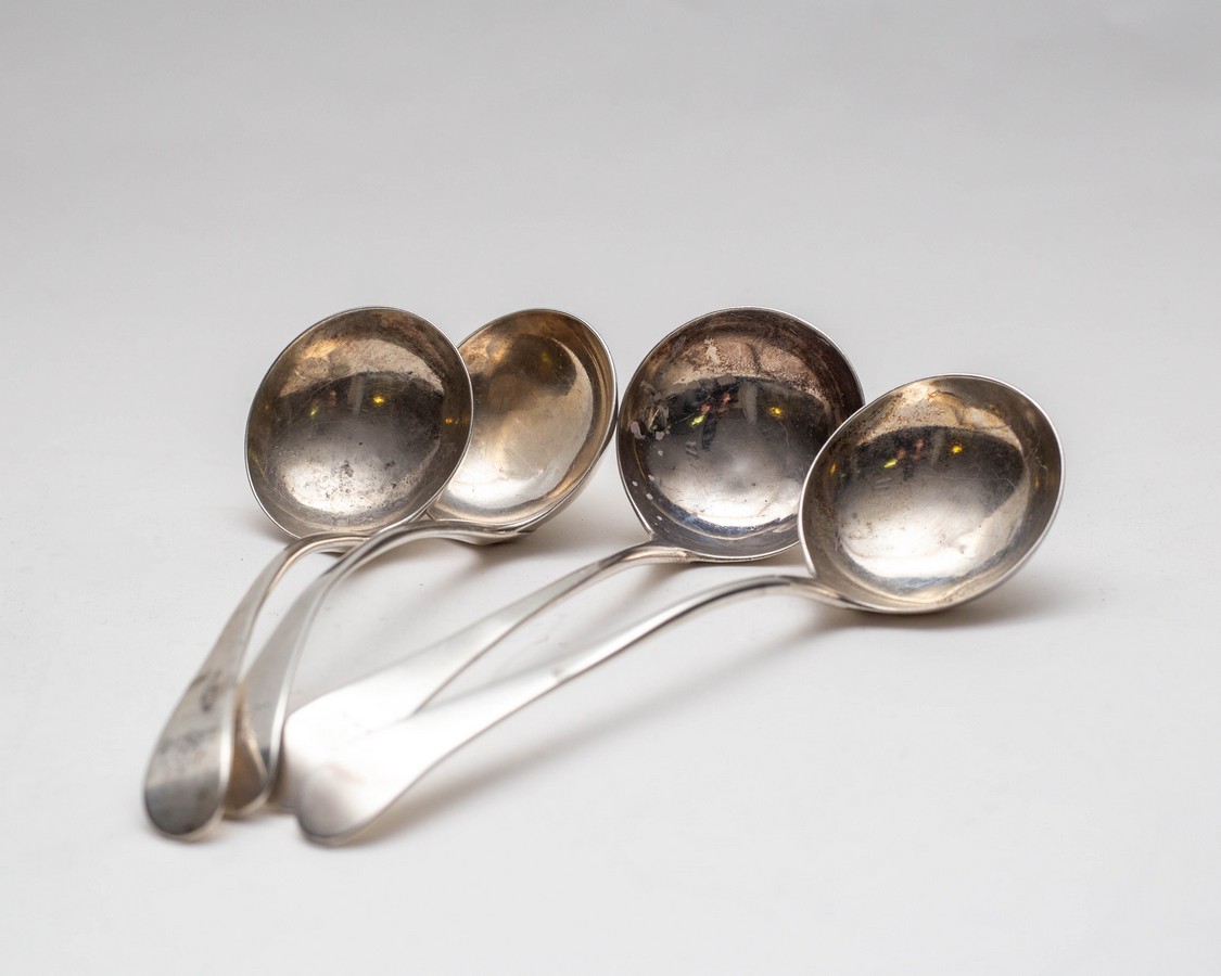 A set of four George III silver ladles, Peter & Ann Bateman, London 1794, crested handles,