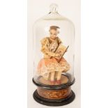 A late 19th Century French automaton of a girl holding a needlework,