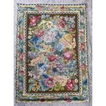 A Savonnerie style hook stitch rug, the moss green field of polychrome floral sprays,