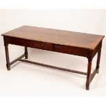 A refectory type table, the rectangular top on chamfered legs united by a central stretcher,