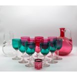 A cranberry-tinted glass decanter and set of six goblets, a small cranberry glass tumbler,