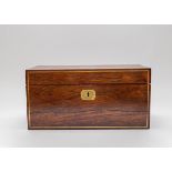 A Regency rosewood tea caddy, rectangular with a pair of lion mask and hoop handles,