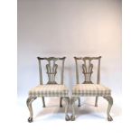 A pair of 18th Century style painted mahogany chairs with pierced splat backs, upholstered seats,