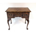 A George III burr elm and walnut lowboy, fitted three drawers,