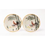 A pair of Chinese porcelain plates, 20th Century, decorated with a cockerel,