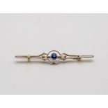 An Edwardian sapphire and pearl bar brooch, set in silver fronted gold, 57mm long approximately 3.