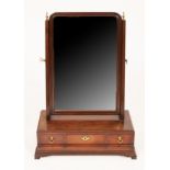 A George II figured mahogany toilet mirror,