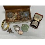 A quantity of costume jewellery in a silver cigarette box CONDITION REPORT: