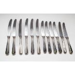 A set of six table knives with plated handles and six side knives,