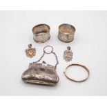 A silver purse, Birmingham 1918, two Russian silver napkin rings, a Christening bangle,