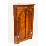 A late 18th Century mahogany corner cupboard,