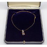 A contemporary synthetic sapphire and diamond pendent necklace, set with three heart-cut stones,