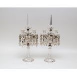 A pair of Baccarat style three-light candelabra, moulded with a central prismatic column,