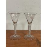 A near pair of 18th Century wine glasses with air twist stems and trumpet bowls, 18.75cm and 18.
