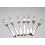 A matched set of seven silver forks, various makers, mid 19th Century,
