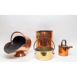 A copper helmet-shaped coal scuttle, a Guernsey hot water can,