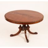 A William IV circular tilt top table on carved column and four legs,