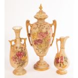 Two Royal Worcester blush ivory vases and a ewer, decorated with garden flowers heightened in gilt,