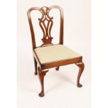 An 18th Century splat-back chair, with a drop-in seat on cabriole legs with pad feet.