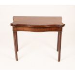 A George III mahogany tea table, the serpentine fold-over top on moulded chamfered legs,