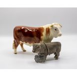 A Beswick figure of a Hereford bull and a plated figure of a bull CONDITION REPORT: