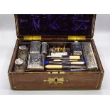 A George IV Goncalo Alves gentleman's dressing case, rectangular brass bound and inlaid,