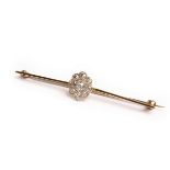 An early 20th Century diamond cluster bar brooch, nine millegrain and claw set old cut diamonds,