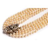 An early 20th Century five strand pearl necklace, the pearls approximately 4mm - 5mm,