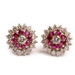 A pair of early 20th Century diamond and ruby target cluster earrings,