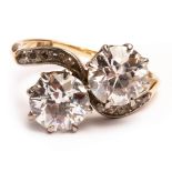 An early 20th Century 'toi et moi' diamond ring, the two round culet cut diamonds approximately 1.