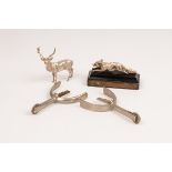 A silver figure of a standing stag, London 1990, 8cm high, a silver model of a running fox,