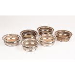 A set of six silver plated wine coasters, gadrooned rims with engraved and pierced sides, 14.
