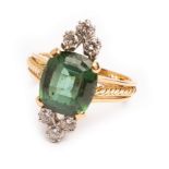 A contemporary green tourmaline and diamond ring, the cushion cut tourmaline approximately 11.