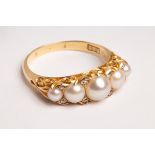 A Victorian pearl and diamond ring, set with five graduated half-pearls,