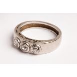 A platinum and diamond three-stone ring, collet set with three old cut stones approximately 0.