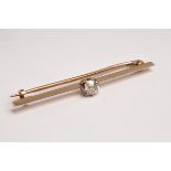 An Edwardian diamond solitaire bar brooch, set with an old cut diamond approximately 0.