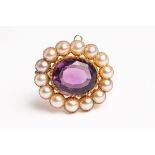 A 19th Century amethyst and pearl oval brooch, the oval mixed cut amethyst approximately 14.