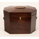 A George III mahogany octagonal box with a hinged domed lid and a drawer below,