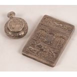 An Indian silver card case, late 19th Century, relief decoration with elephants,