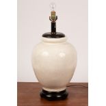 A large crackleware vase of baluster form on a hardwood stand, now converted as a lamp base,
