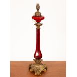 A Victorian table lamp with fourteen-sided tinted glass well and ten-sided bar shaped column with