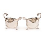 A pair of George III silver sauce boats, possibly William Skeen, London 1763, each with wavy rim,