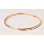 A 9ct gold bangle, plain form, approximately 12.