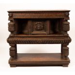 A Victorian carved oak court cupboard, the top with chequered frieze,