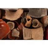 Roman terra sigillata pottery pieces, some with archaeological labelling,