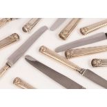 A set of silver handled shell pattern knives, GH, Sheffield 1958, comprising eleven table knives,