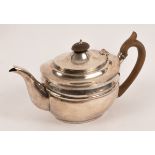 A George III style silver teapot, Charles Stuart Harris & Sons, London 1905, of reeded plain form,