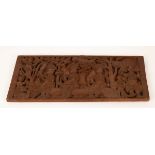 An African carved wooden panel, perhaps Nigeria, depicting figures, a leopard, etc.